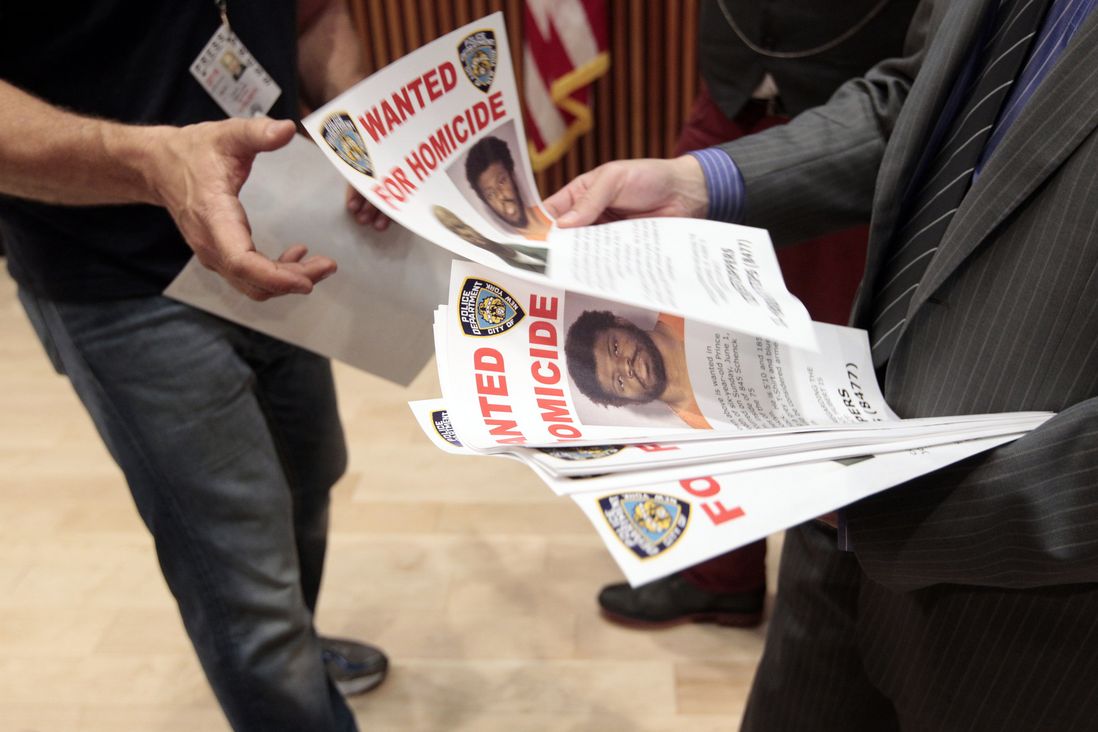 Police distributed Wanted posters after a press conference yesterday
